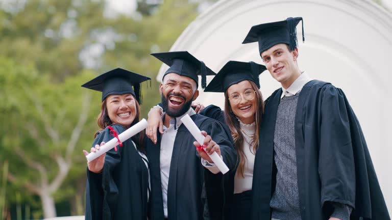 Two students looking at a tablet and smiling